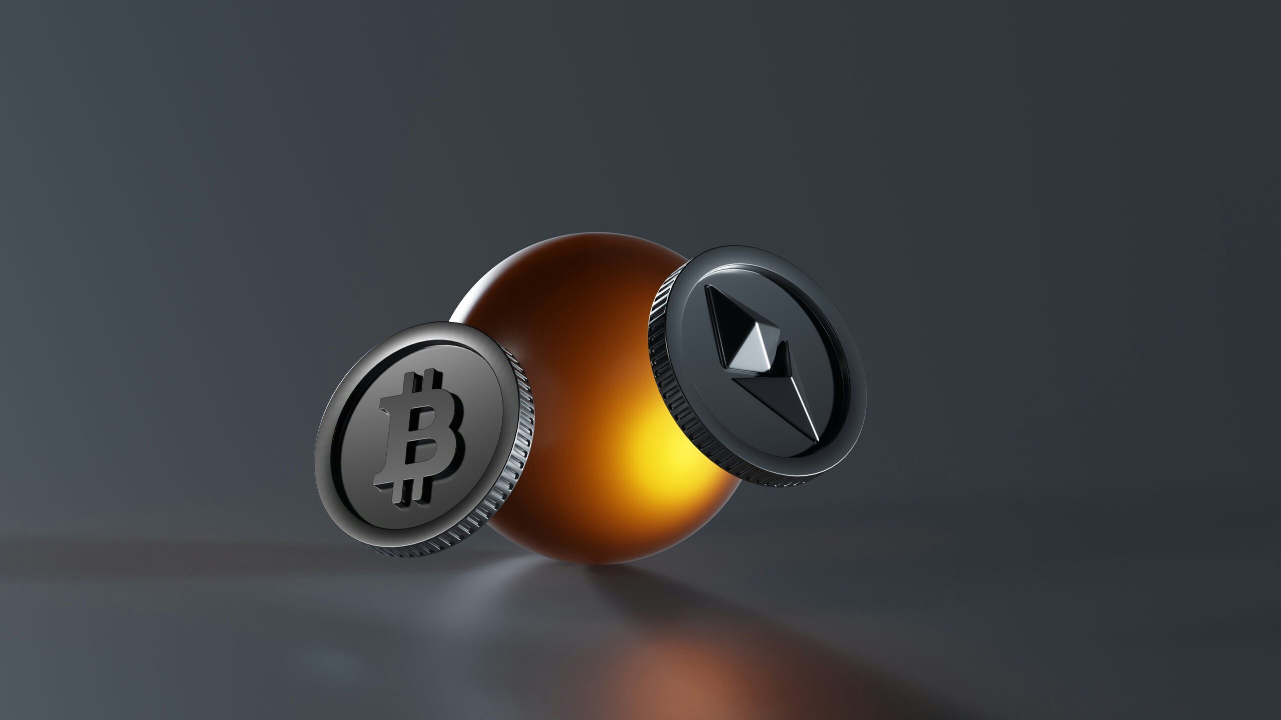 a bitcoin and a lite up coin on a table